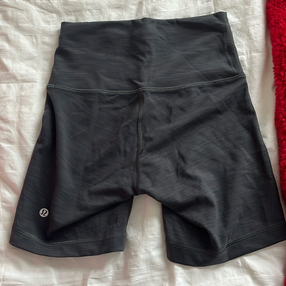 Black never wore before lululemon biker shorts with adjustable waist strap.